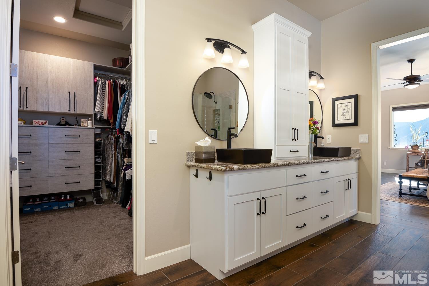 Undisclosed Address Minden, NV 89423 - Photo 15 of 33 a bathroom with a sink double vanity and a mirror