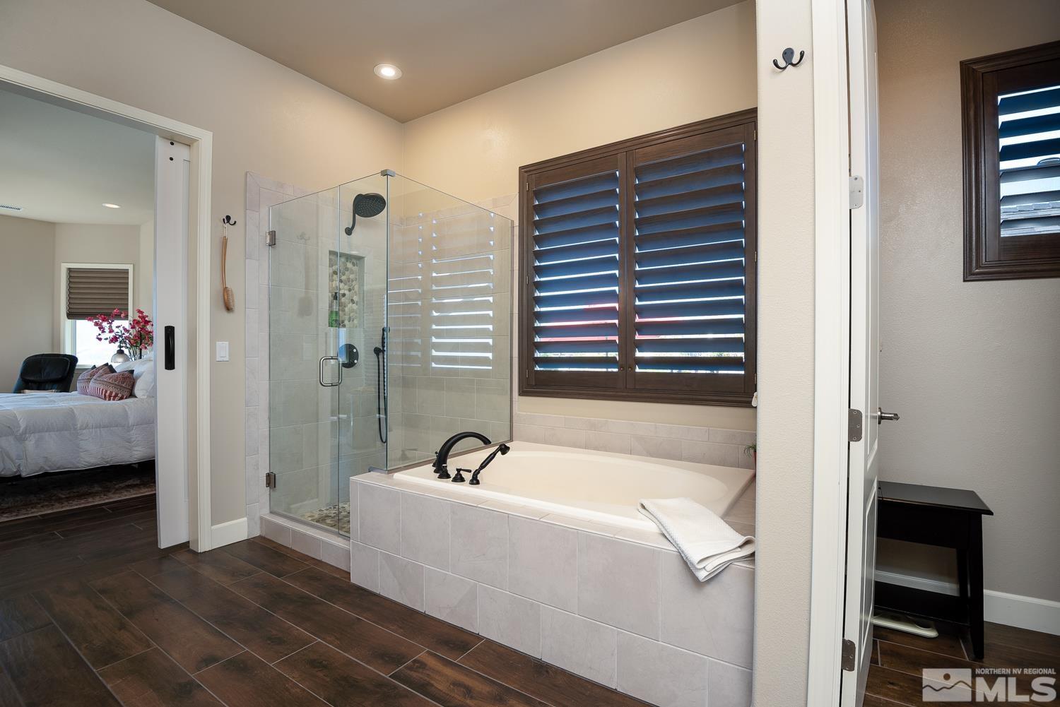 Undisclosed Address Minden, NV 89423 - Photo 16 of 33 a bathroom with a bathtub and a sink