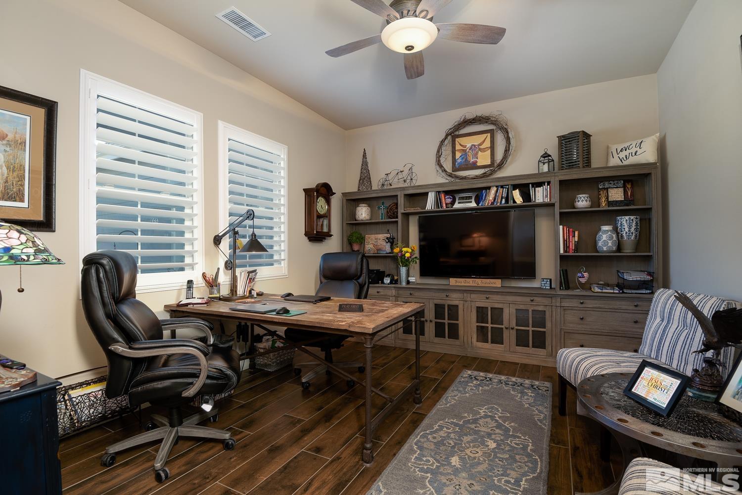 Undisclosed Address Minden, NV 89423 - Photo 17 of 33 a view of a livingroom with workspace and a window