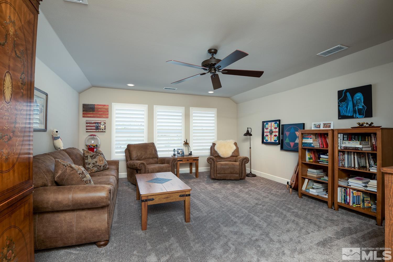 Undisclosed Address Minden, NV 89423 - Photo 22 of 33 a living room with furniture and a flat screen tv