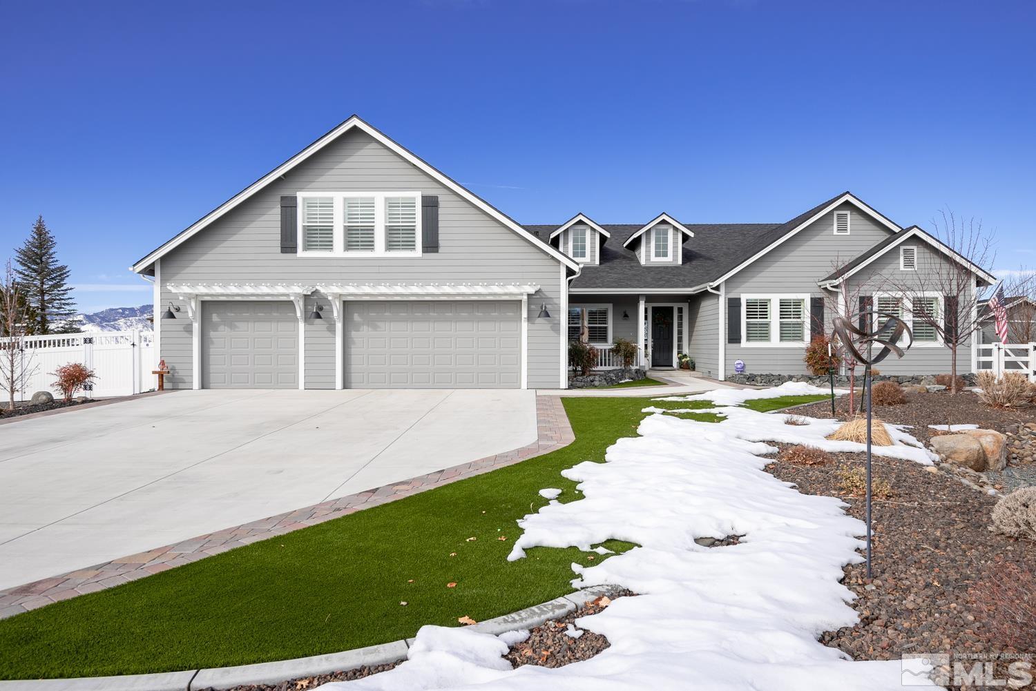Undisclosed Address Minden, NV 89423 - Photo 4 of 33 a front view of a house with a garden and yard