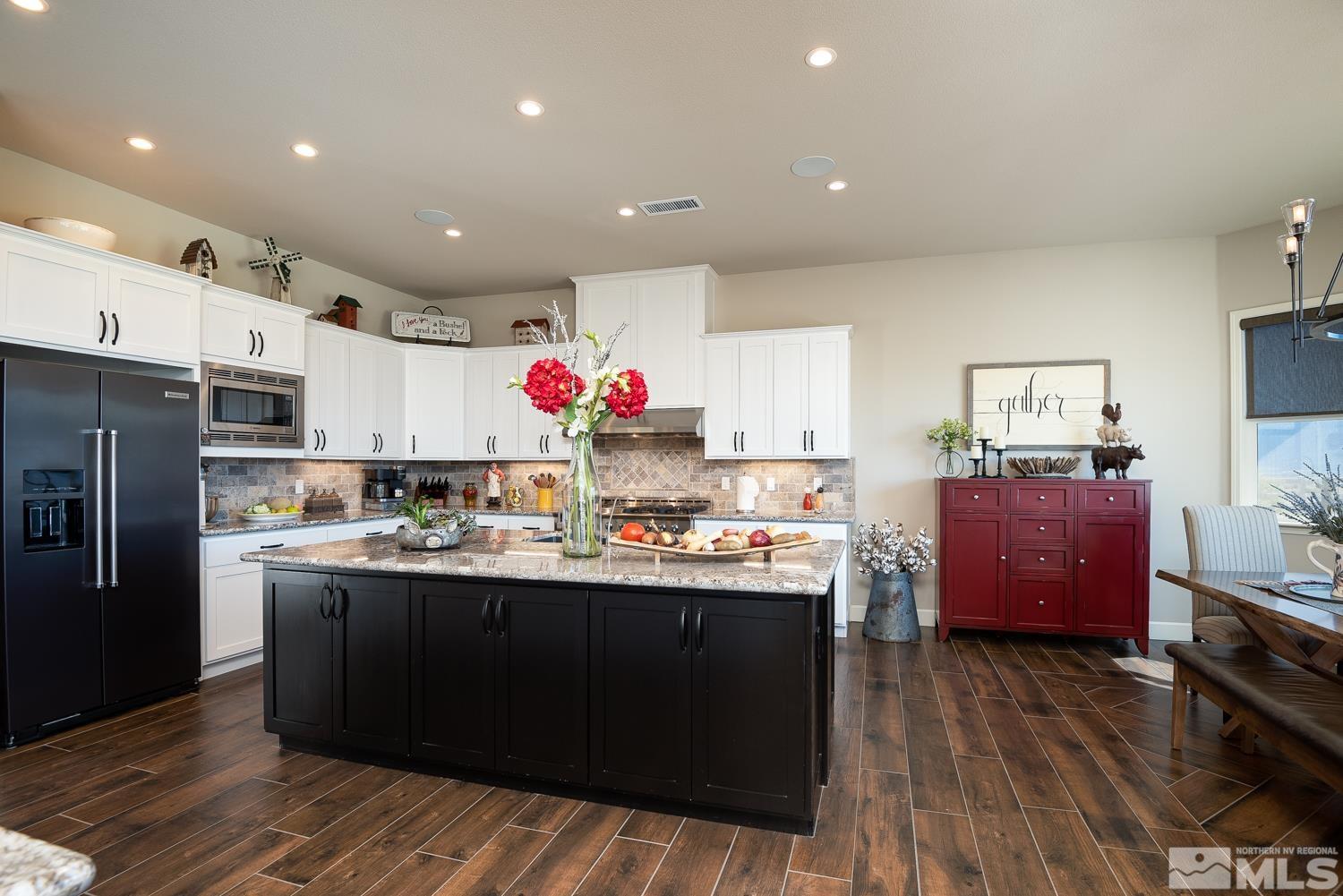 Undisclosed Address Minden, NV 89423 - Photo 8 of 33 a kitchen with granite countertop a sink cabinets and wooden floor