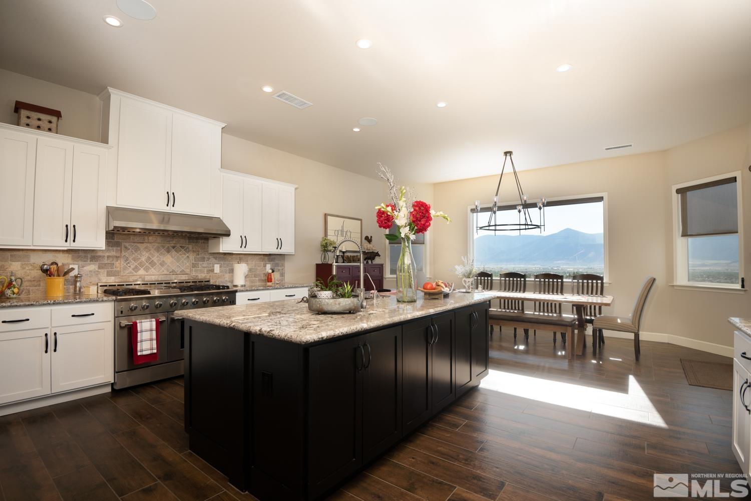 Undisclosed Address Minden, NV 89423 - Photo 9 of 33 a kitchen with sink stove and cabinets