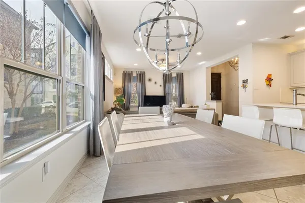 a large room with a large window and chandelier