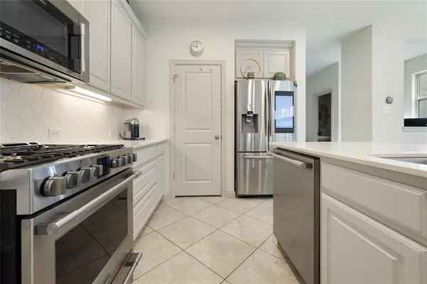 a view of staircase with wooden floor and white walls