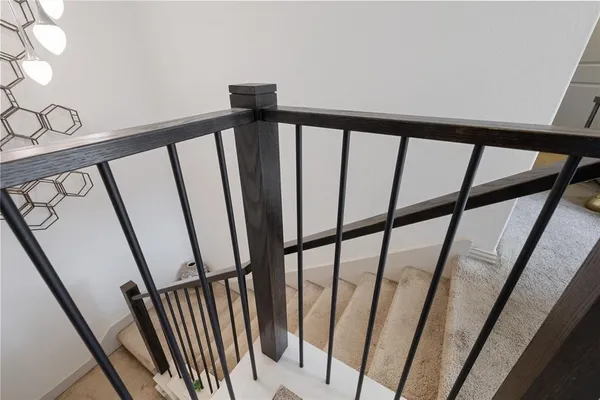 a living room with table chairs and a flat screen tv