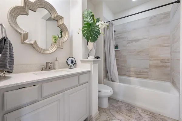 a bathroom with a toilet and a sink