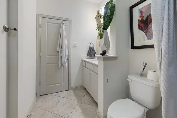 a view of a hallway with couch and closet