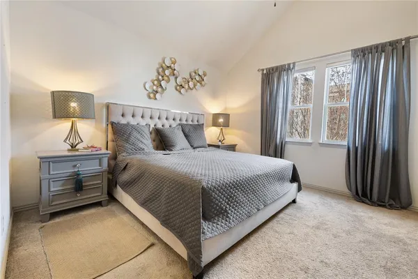 a bathroom with a shower sink and mirror