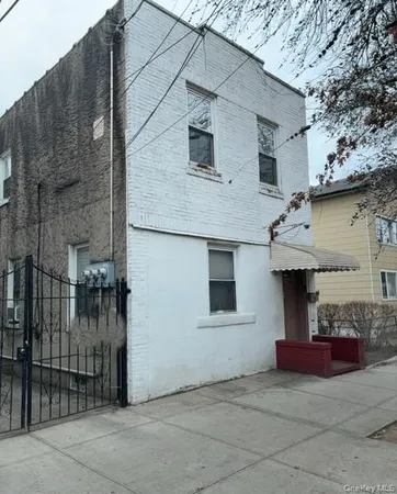 a front view of a house with garage