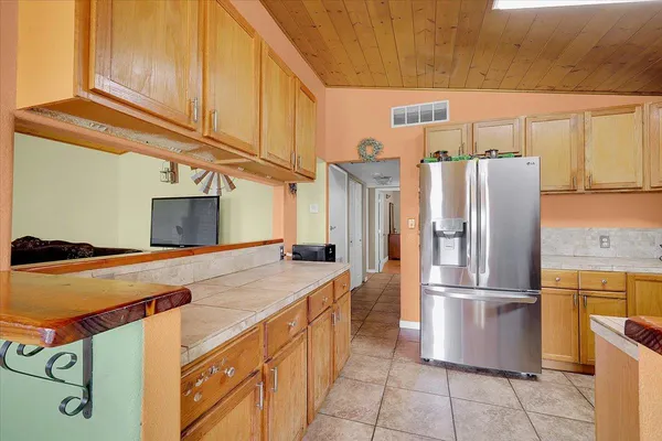 a kitchen with stainless steel appliances a refrigerator stove and microwave