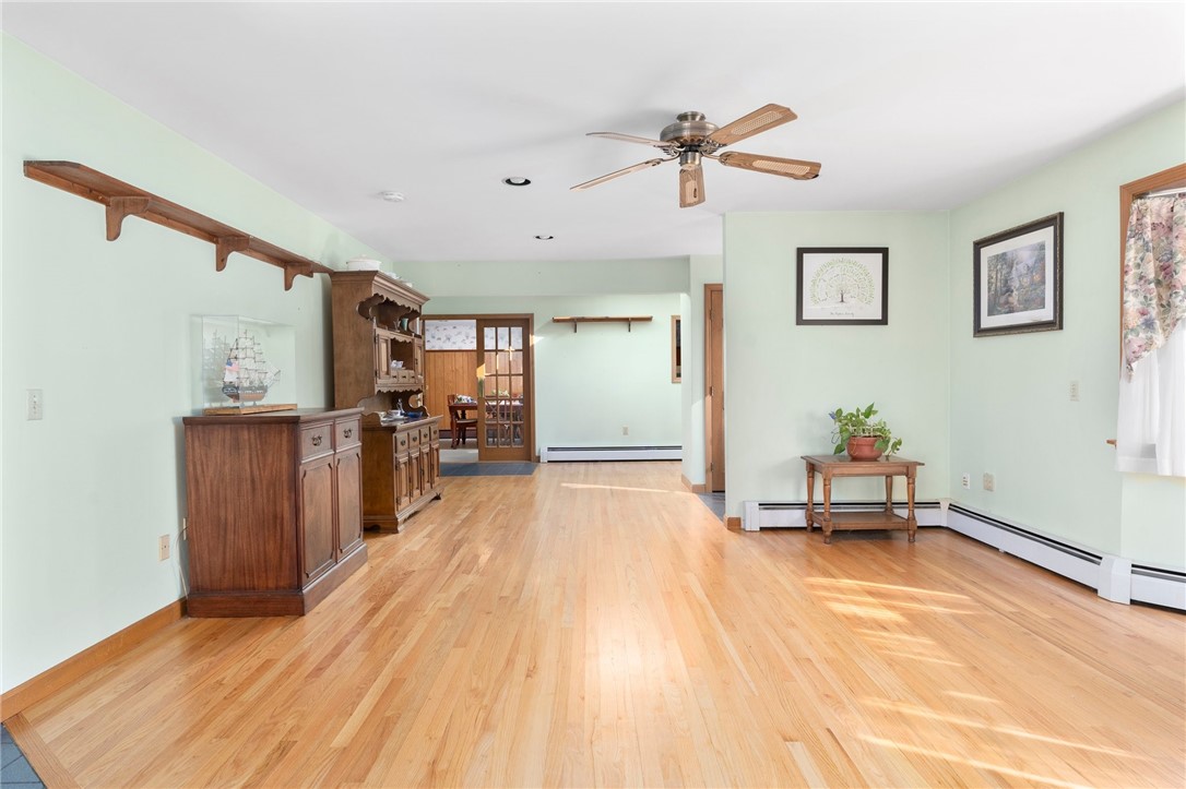 105 Appleton Street Cranston, RI 02910 - Photo 7 of 26 The family room offers baseboard heating for maximum space and leads to both the sun room and the kitchen.