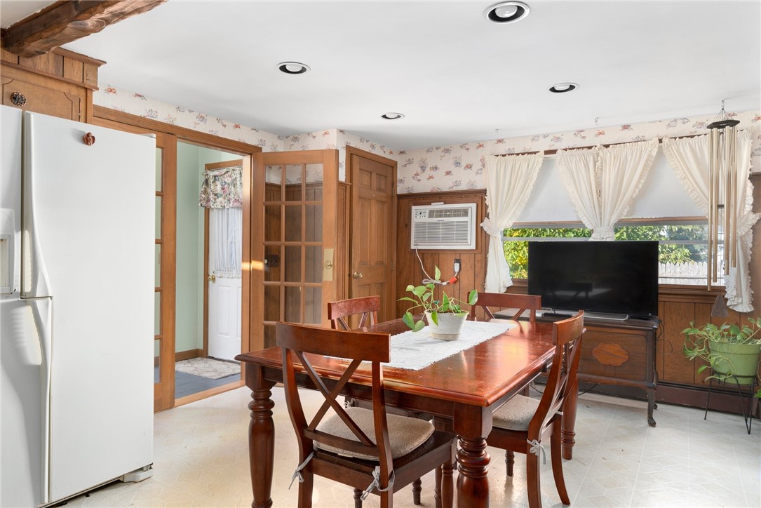 105 Appleton Street Cranston, RI 02910 - Photo 8 of 26 Enter into the eat-in-kitchen that has a large dining area that is able to accommodate larger dining sets.