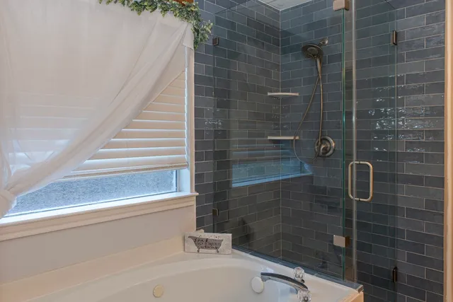 a bathroom with a sink and shower