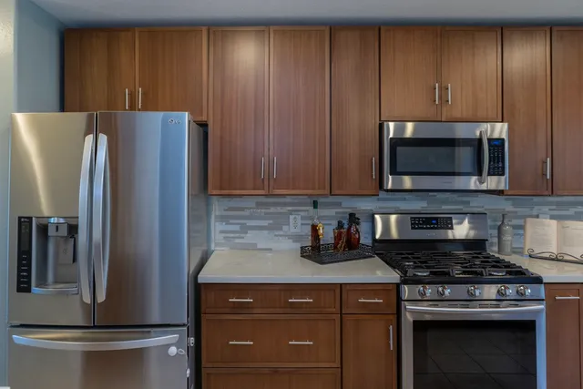 a kitchen with a stove and a microwave