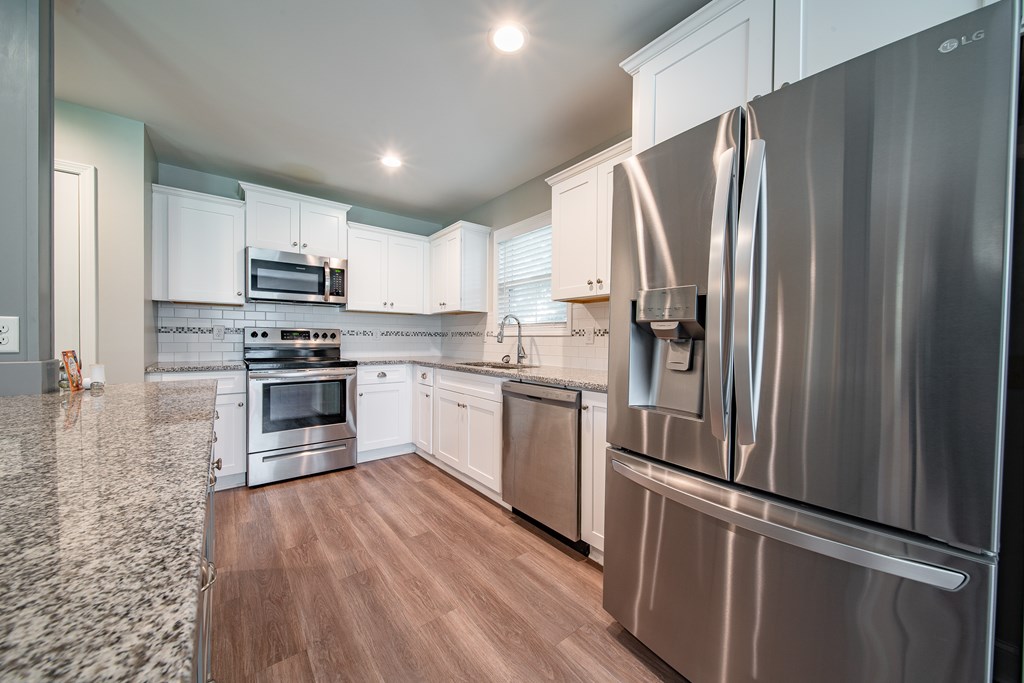 16 Maxwell Drive Fort Mitchell, AL 36856 - Photo 23 of 25 a kitchen with stainless steel appliances a refrigerator sink and microwave