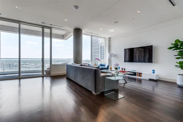 a living room with furniture and a flat screen tv