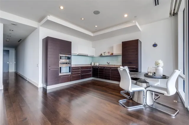 a view of kitchen with cabinets and wooden floor
