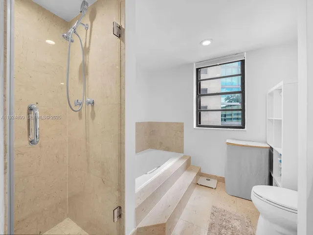 a bathroom with a bathtub and a shower