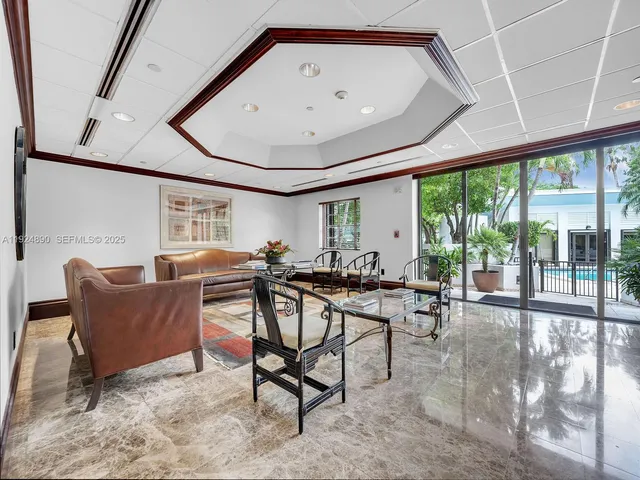 a view of a livingroom with furniture and a window