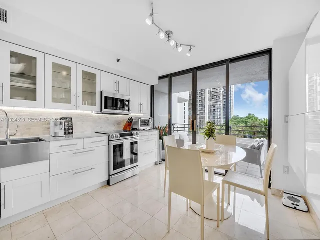 a kitchen with a stove top oven sink and cabinets