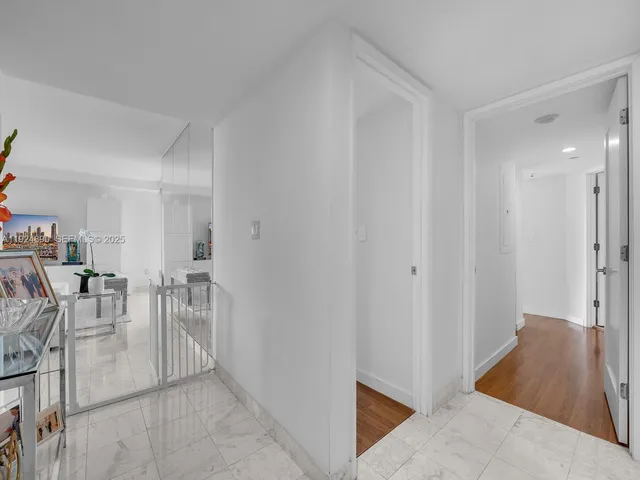 a view of a livingroom with furniture and gym equipment