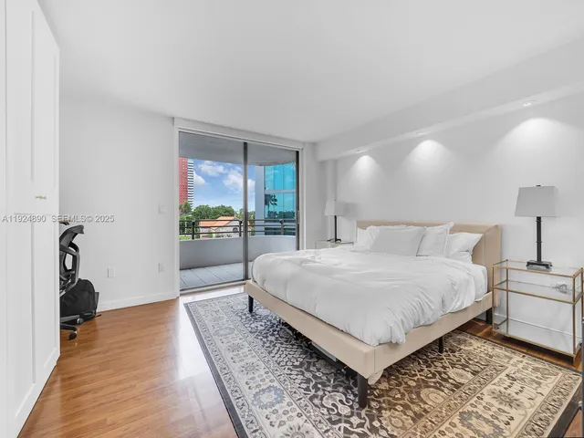 a bedroom with a bed and a walk in closet