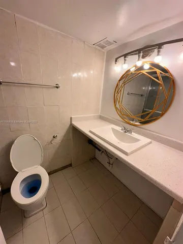 a bathroom with a sink and mirror