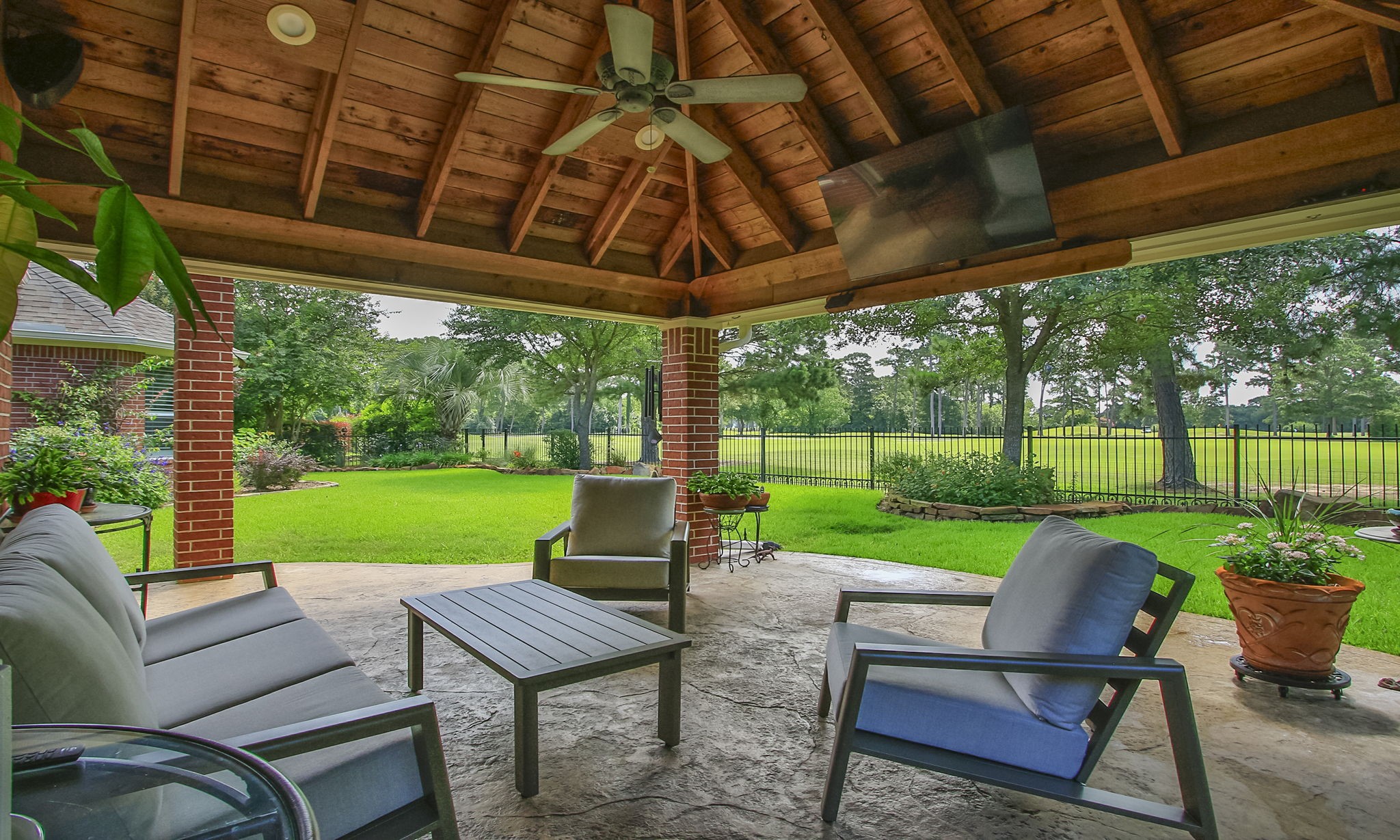 20110 Stormy Pine Lane Spring, TX 77379 - Photo 33 of 44 Step outside and fall in love with this premier outdoor living space featuring a huge covered patio and breathtaking panoramic golf course views!