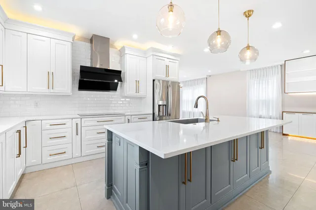 a kitchen with a sink stove and microwave