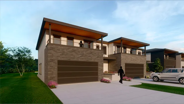 a front view of a house with a yard and a garage