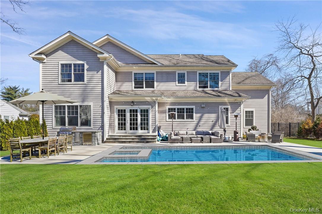 81 Spier Road Scarsdale, NY 10583 - Photo 23 of 32 A perfect summer retreat. Custom built stone bbq and blue stone patio.