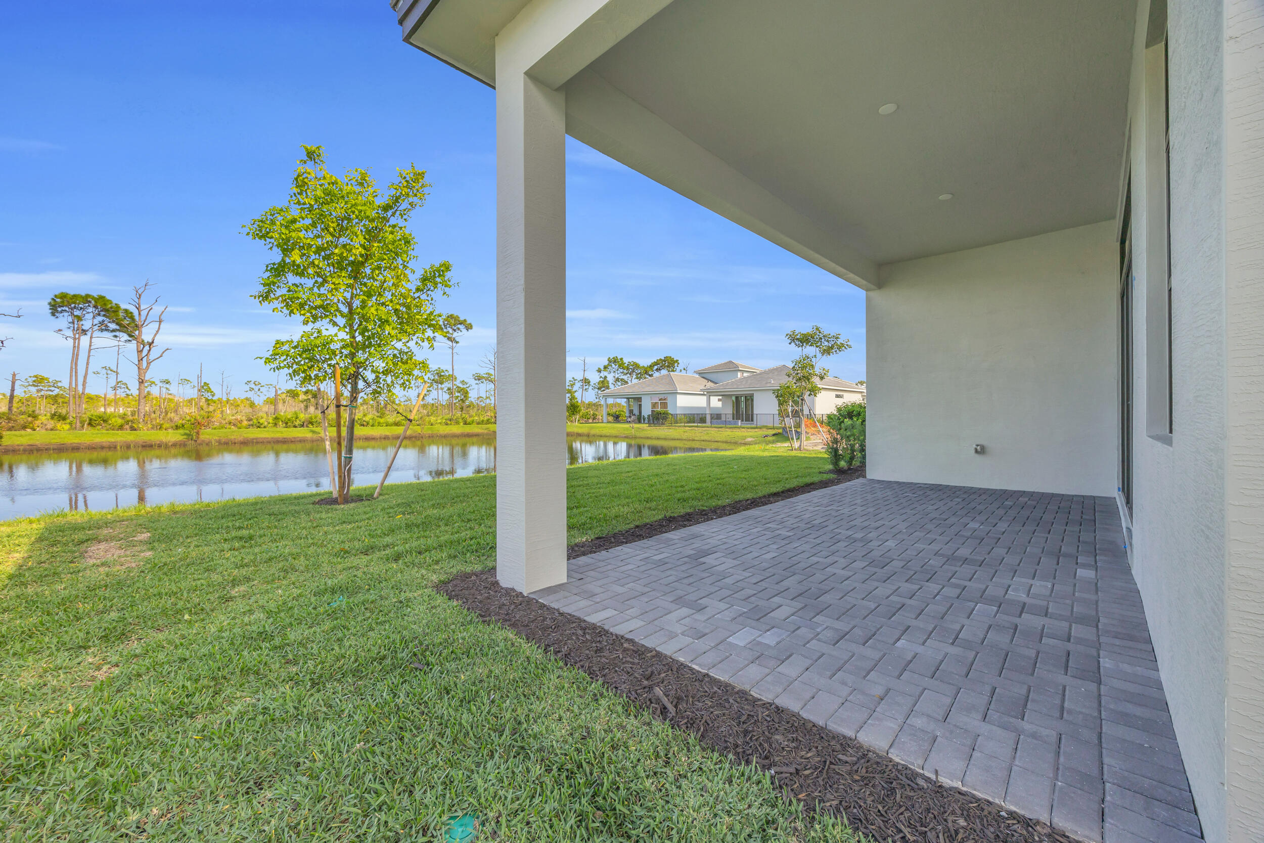 7155 Southeast Amalfi Lane Stuart, FL 34997 - Photo 32 of 41 Patio/Pond