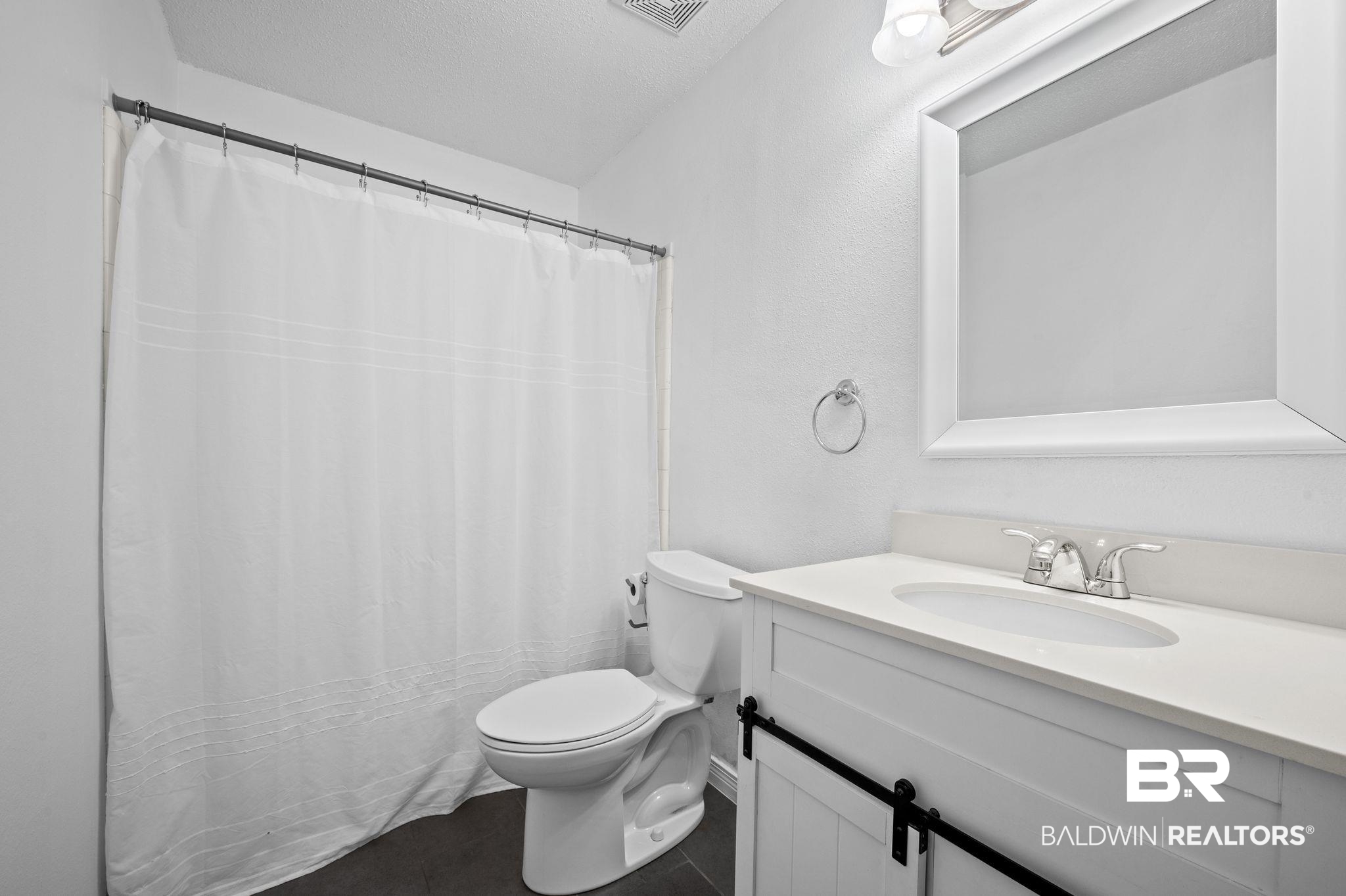 3716 Pepper Ridge Drive Mobile, AL 36693 - Photo 14 of 20 Bathroom featuring toilet, vanity, and tile patterned flooring