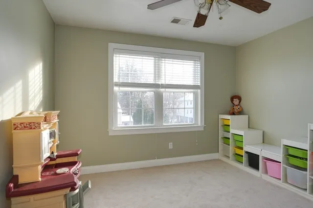 an empty room with furniture and a window