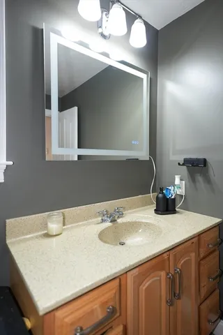 a bathroom with a sink and a mirror