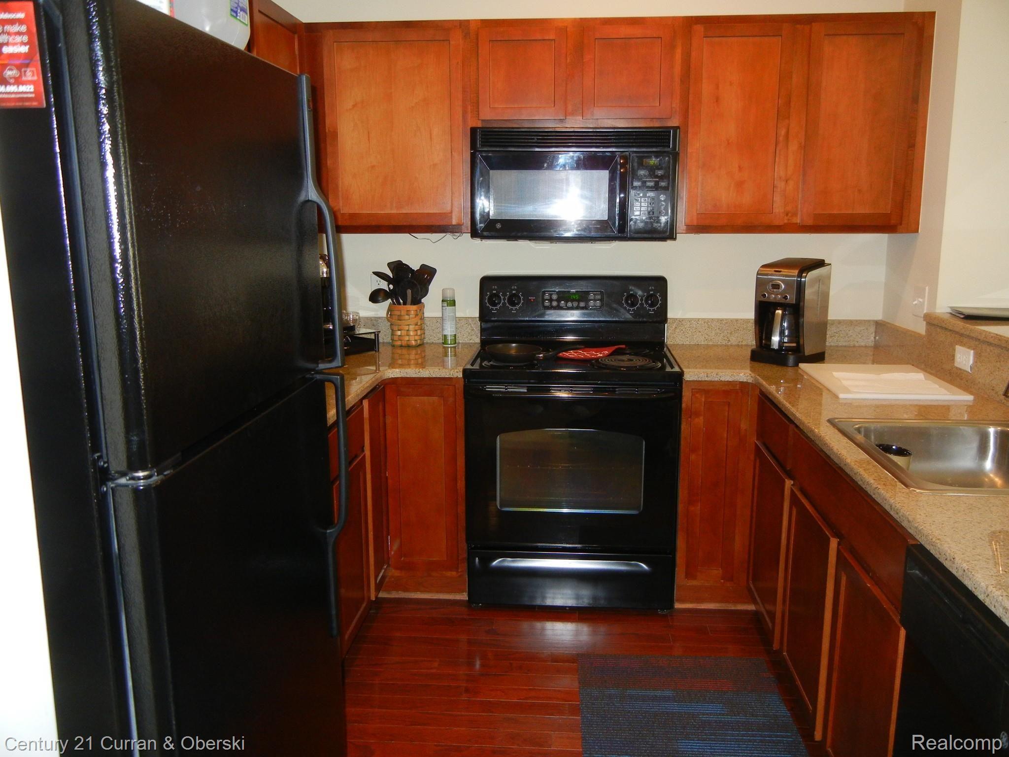 270 North Wixom Road, Unit 60 Wixom, MI 48393 - Photo 11 of 26 Newer appliances and Granite counters