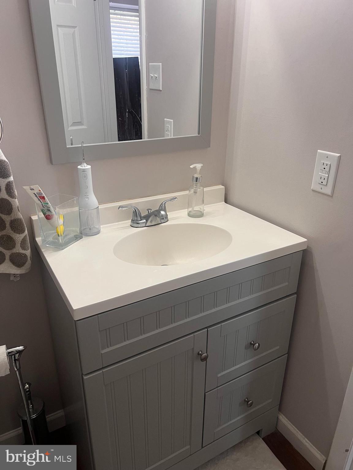 208 Ashley Run Voorhees, NJ 08043 - Photo 14 of 14 a bathroom with a sink and a mirror