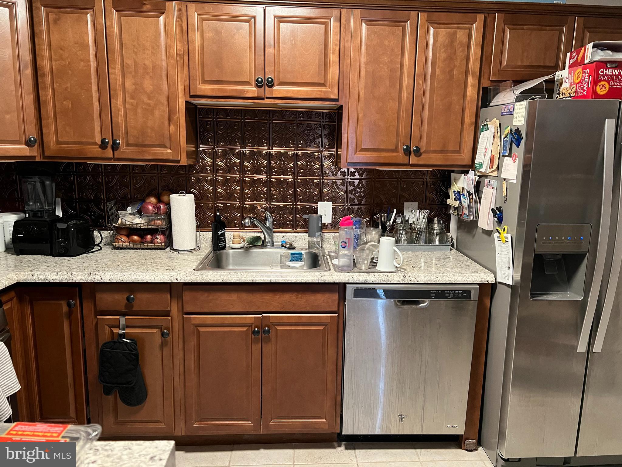 208 Ashley Run Voorhees, NJ 08043 - Photo 7 of 14 a kitchen with stainless steel appliances granite countertop a refrigerator a sink a stove and a microwave