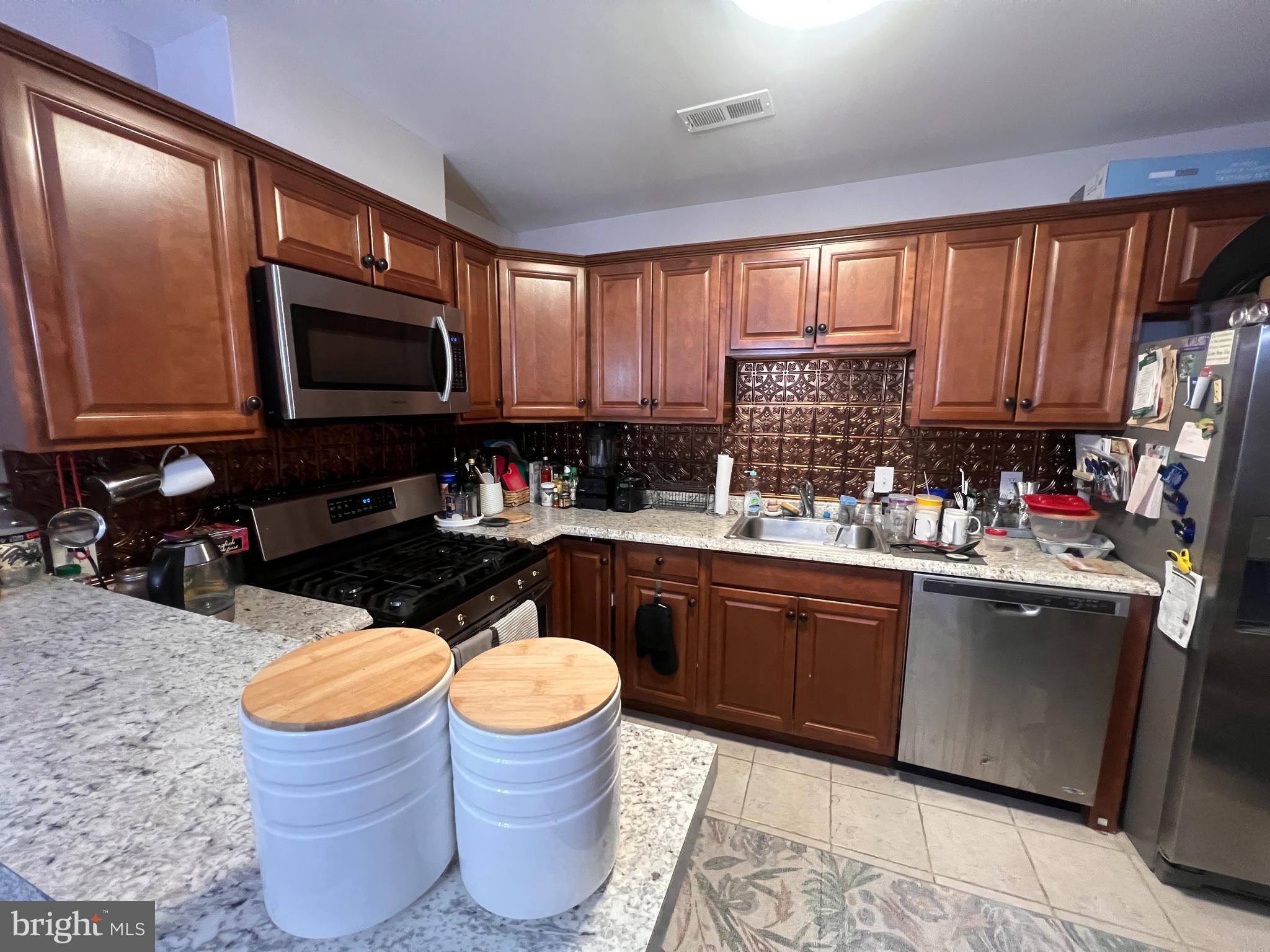 208 Ashley Run Voorhees, NJ 08043 - Photo 8 of 14 a kitchen with stainless steel appliances granite countertop a sink dishwasher microwave stove and granite countertops