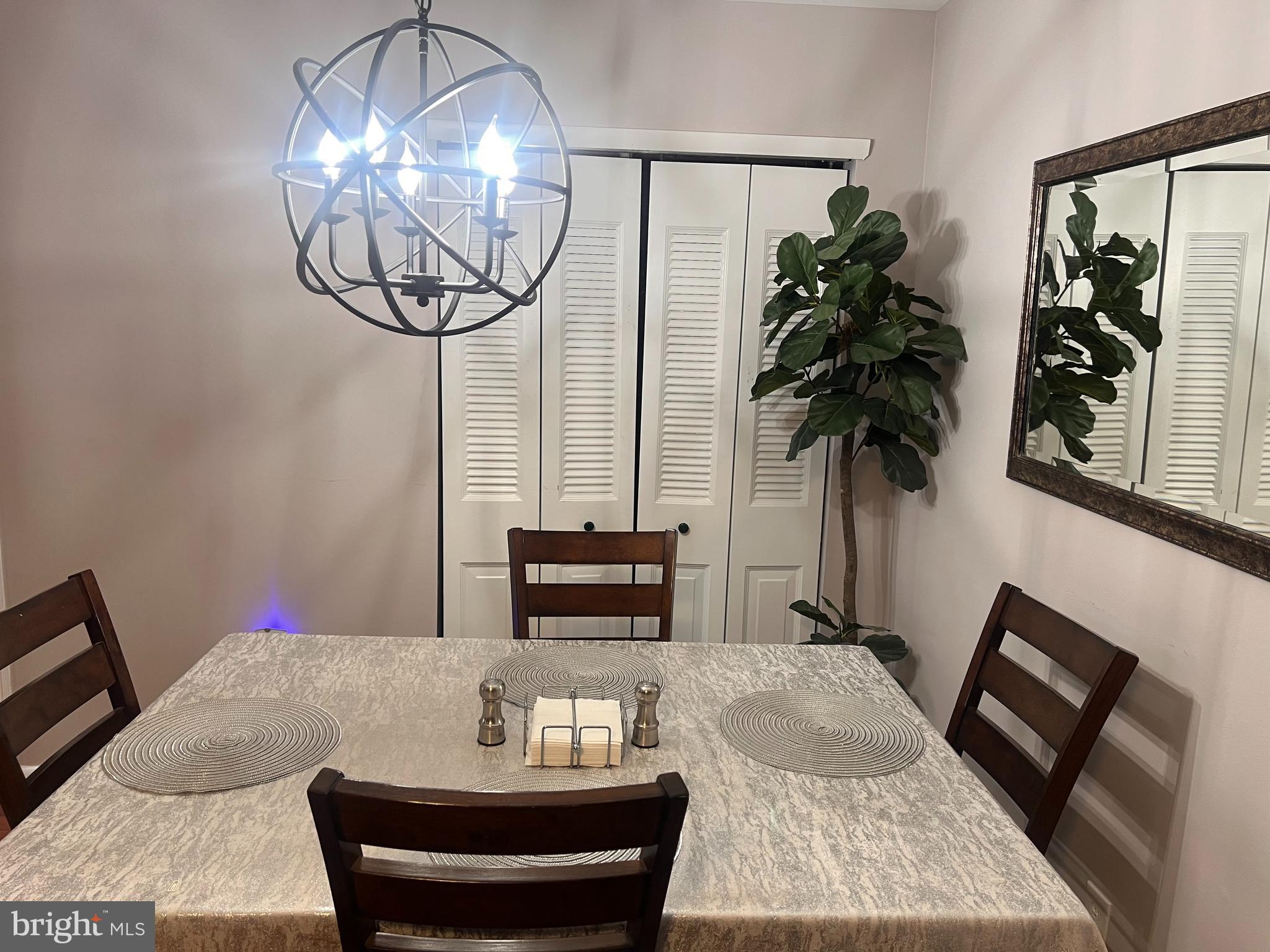 208 Ashley Run Voorhees, NJ 08043 - Photo 9 of 14 a living room with furniture and a chandelier