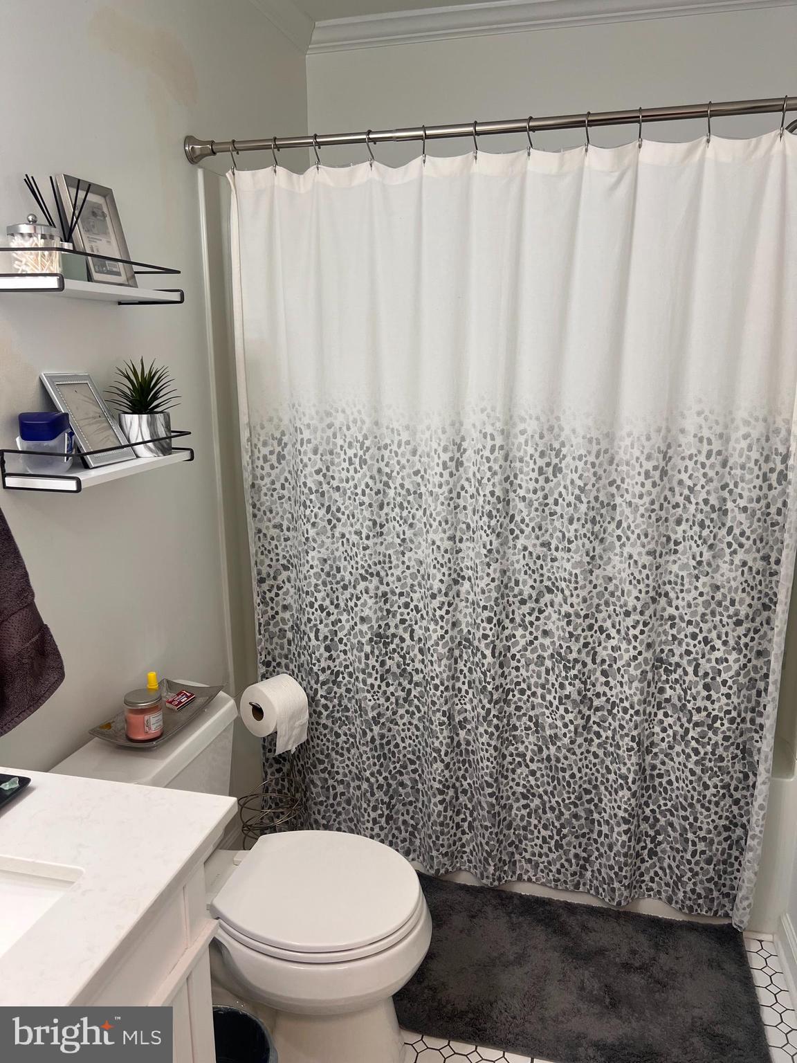 208 Ashley Run Voorhees, NJ 08043 - Photo 10 of 14 a bathroom with a toilet and a shower curtain