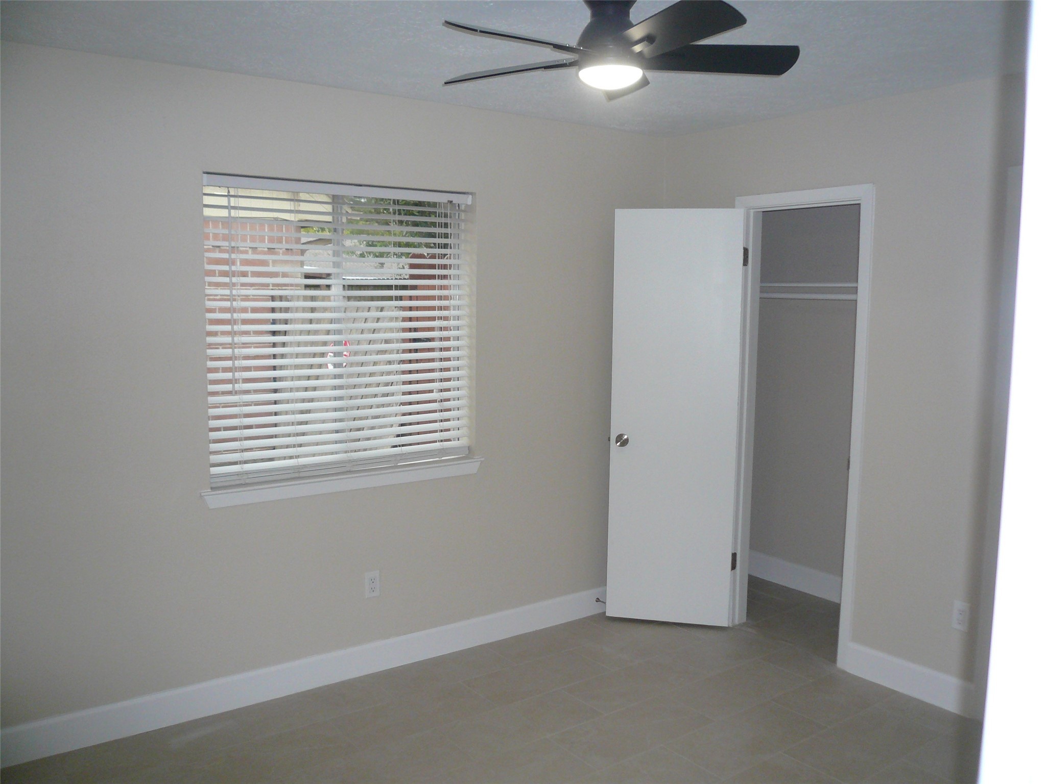 4910 Hennington Drive Spring, TX 77388 - Photo 13 of 18 a view of an empty room with a window