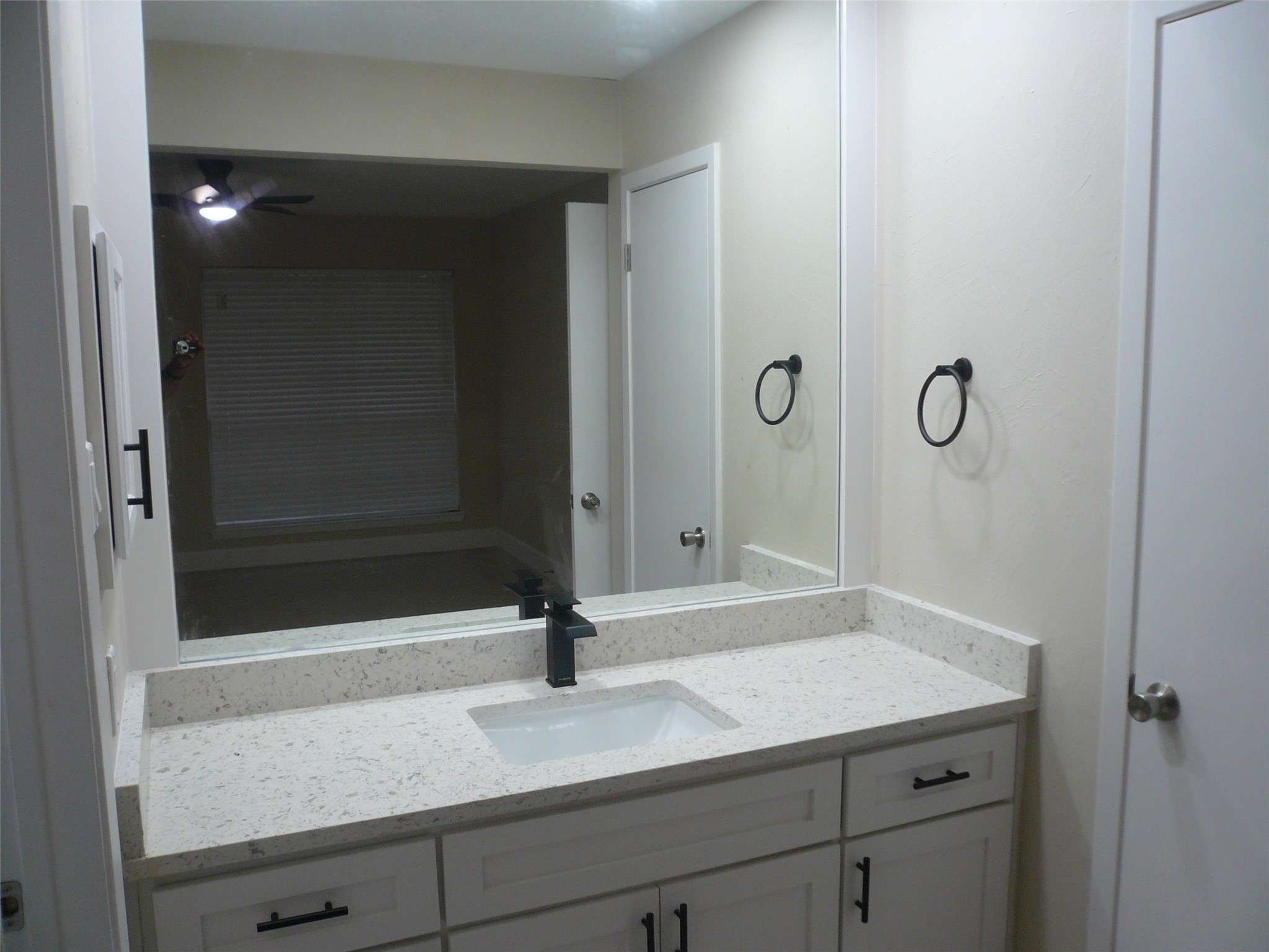 4910 Hennington Drive Spring, TX 77388 - Photo 10 of 18 a bathroom with a granite countertop sink and mirror