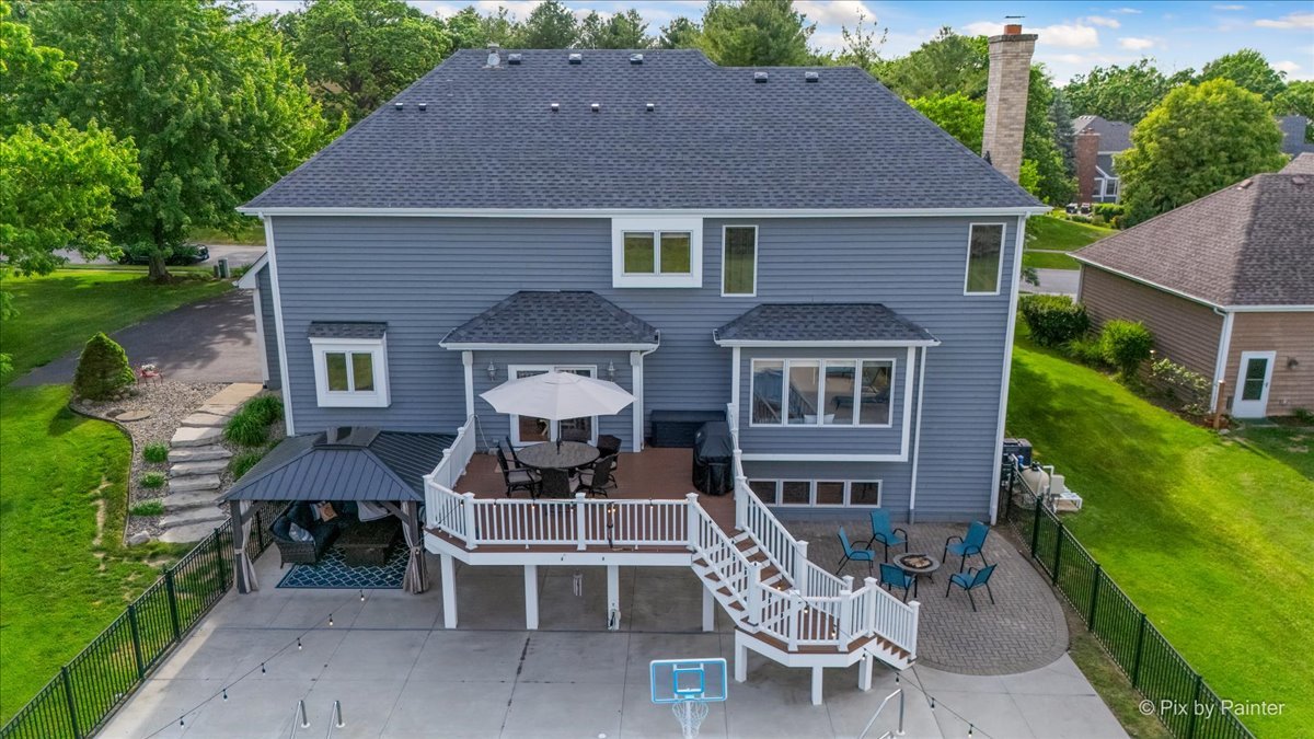 7104 Dove Way Cary, IL 60013 - Photo 69 of 82 a front view of a house with a yard and outdoor seating