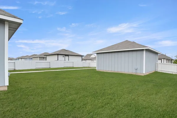 a view of a back yard of the house
