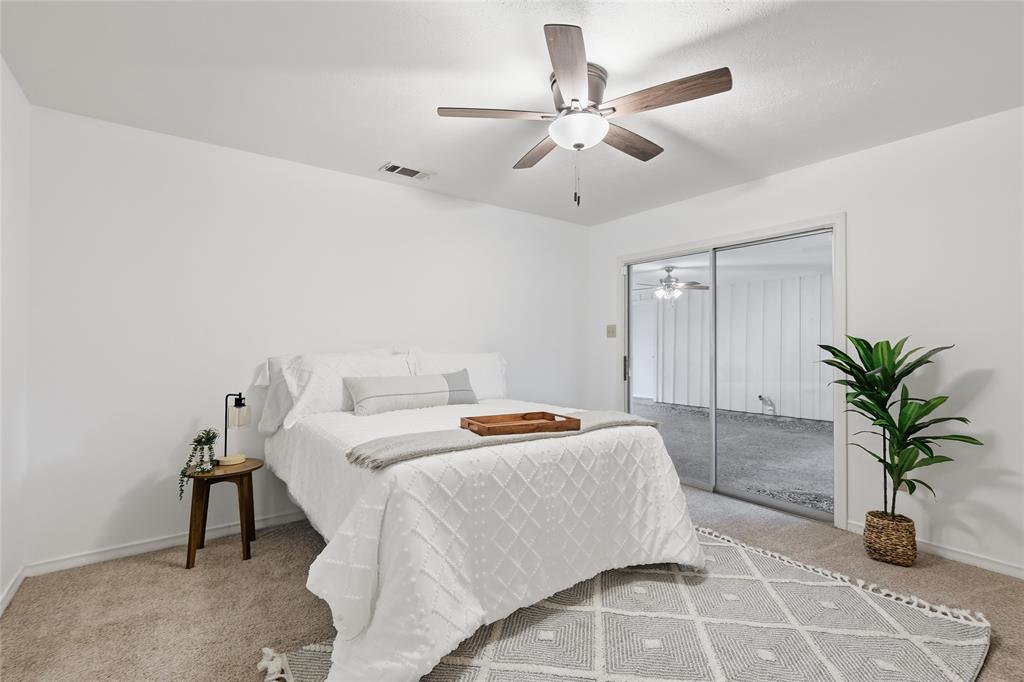 823 Ridgecrest Circle Denton, TX 76205 - Photo 29 of 40 Room featuring neutral-toned carpet flooring and white walls