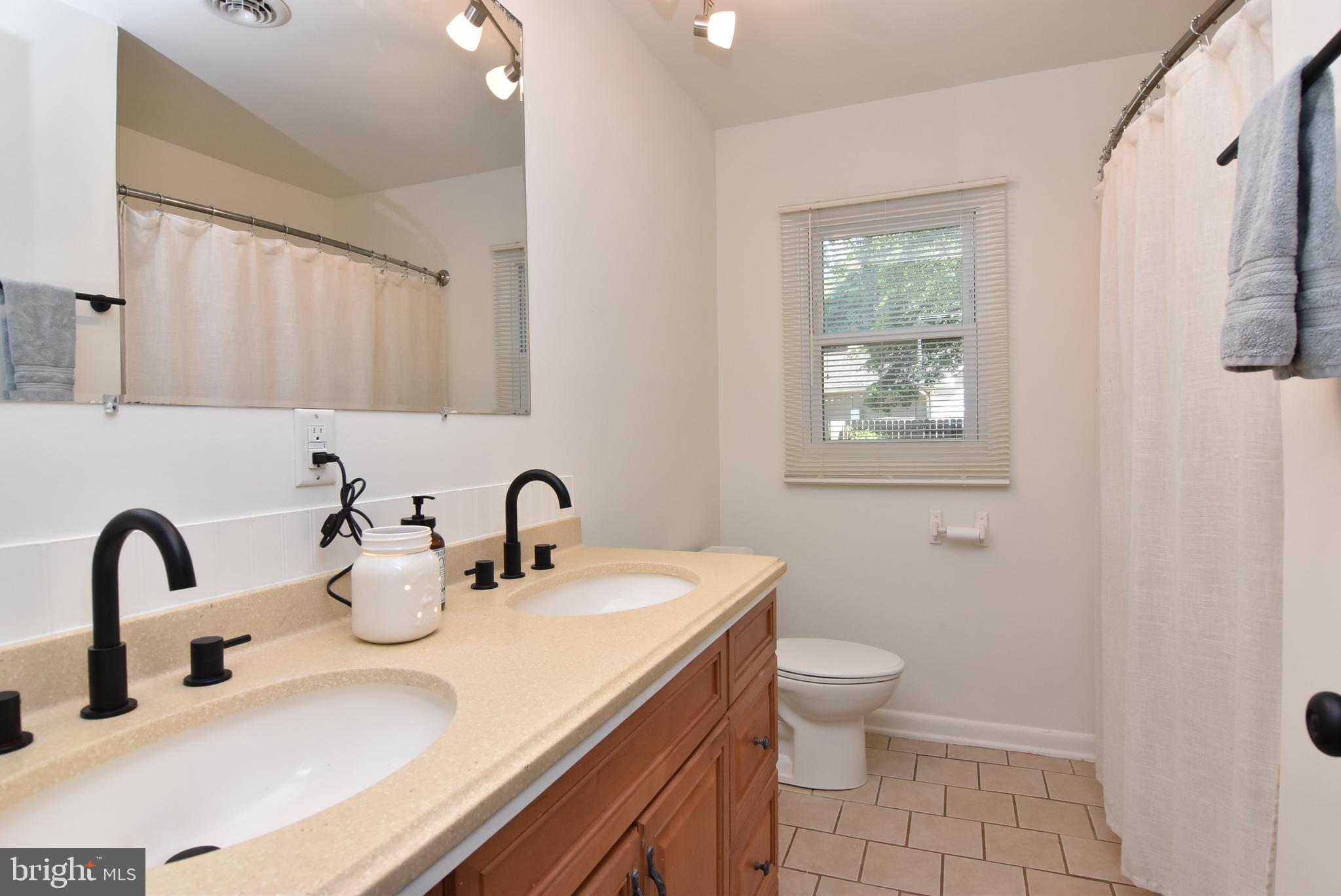 9012 Concord Road Seaford, DE 19973 - Photo 23 of 24 a bathroom with a sink and a toilet