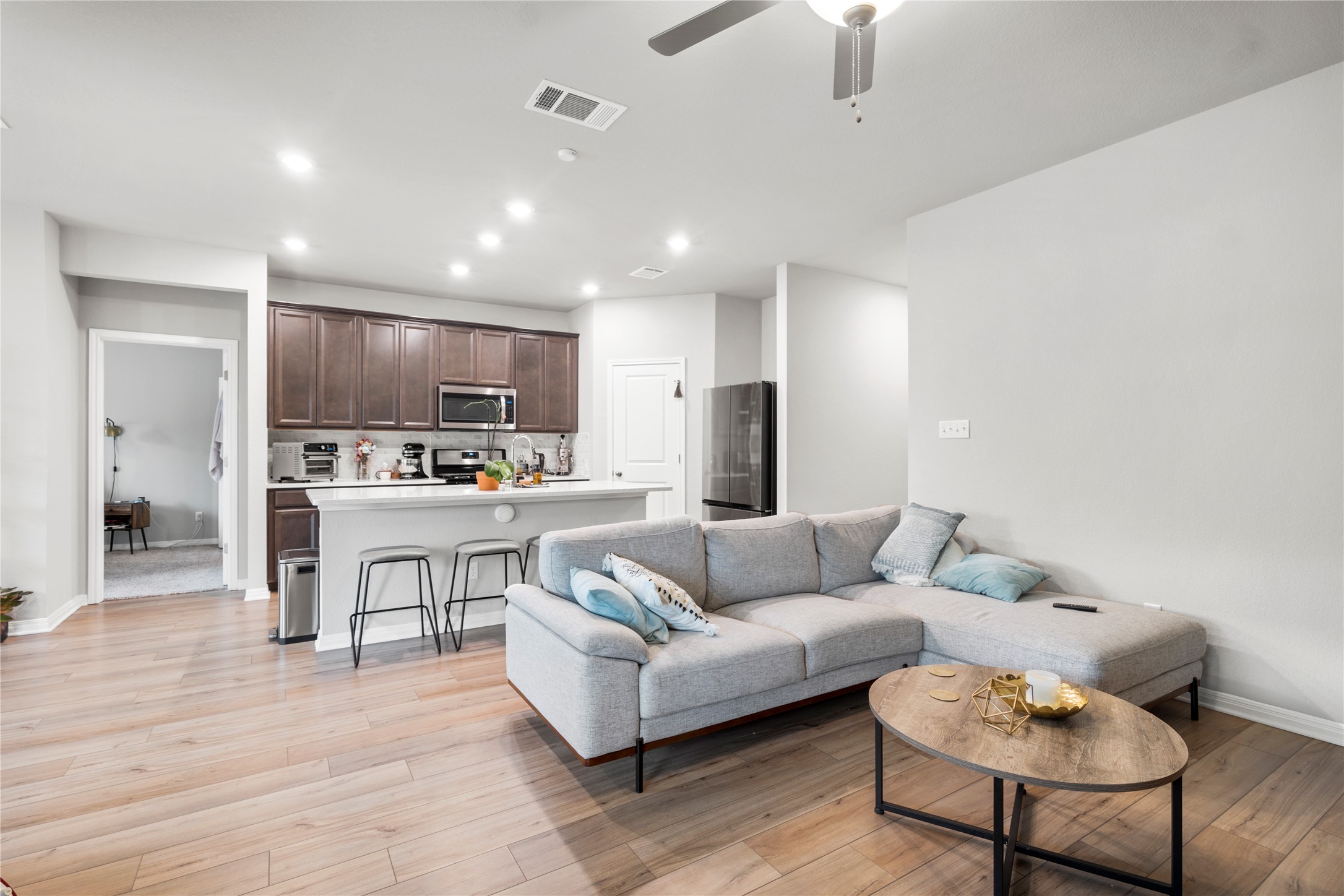 11701 Copperstone Avenue Austin, TX 78748 - Photo 10 of 29 Living area with ceiling fan, recessed lighting, and light wood-style flooring