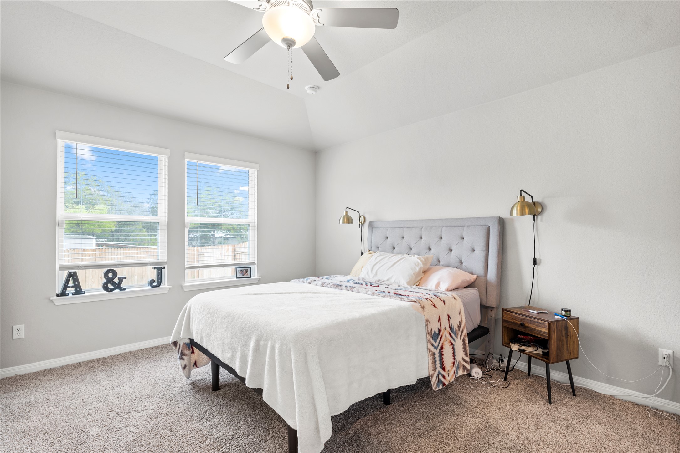 11701 Copperstone Avenue Austin, TX 78748 - Photo 14 of 29 Carpeted bedroom featuring vaulted ceiling and a ceiling fan